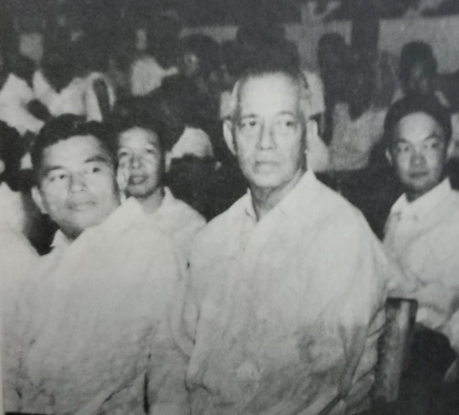 League founder Chito Calvo and boyish-looking Crispa team owner Danny Floro watch the MICAA opening rites in July 1963.