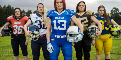 The five team captains in Gridiron West Women's League, with Rhyanna Edbrooke in the centre.(Supplied: Angelo Di Carlo) via www.abc.net.au