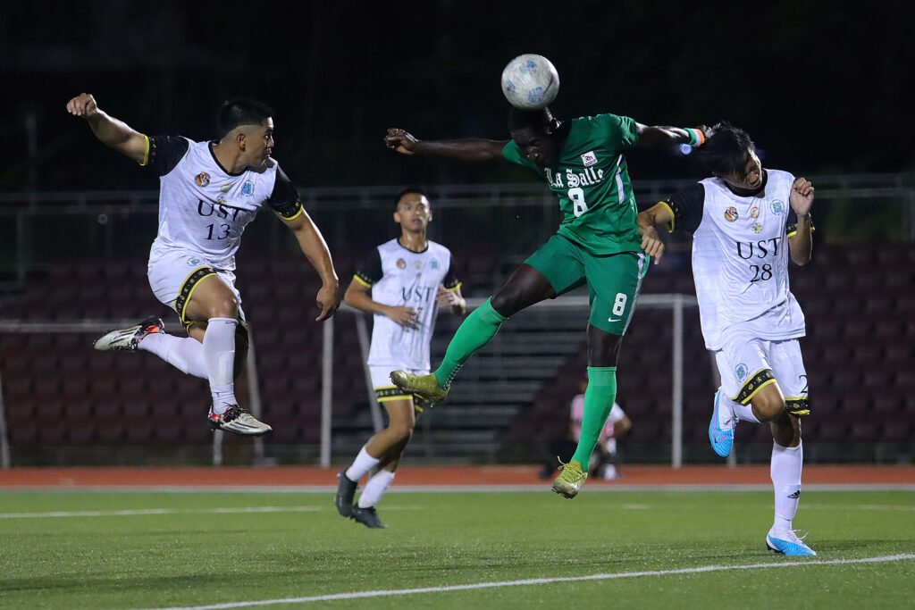 Junuel Finza (UST) and Franck Anoh (DLSU) [UAAP Media Bureau]