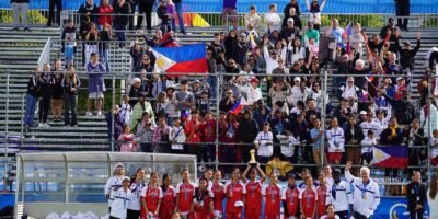 Makati FC Girls 14 team proudly displays its Gothia World Youth Cup hardware along with Filipino supporters. [MAKATI FC PHOTO]