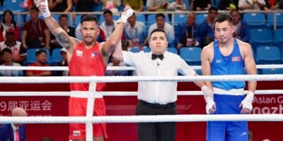 Eumir Marchial (in red) raises his arms after winning at the 2023 Asian Games in Hangzhou, China. [PSC-POC photo release]