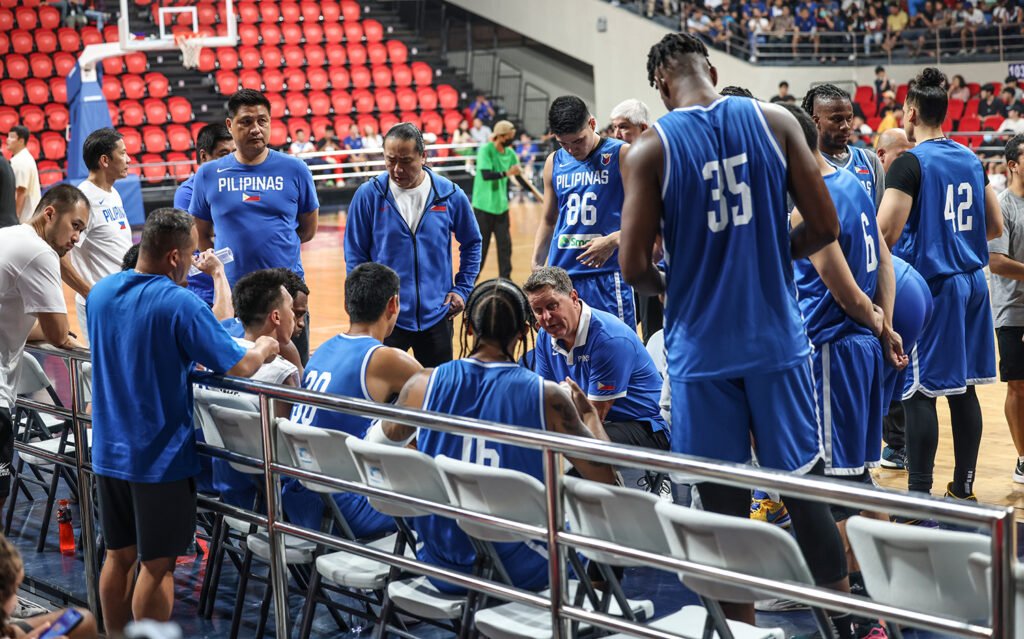 Philippine team head coach Tim Cone giving instructions to his players. [PBA Images]