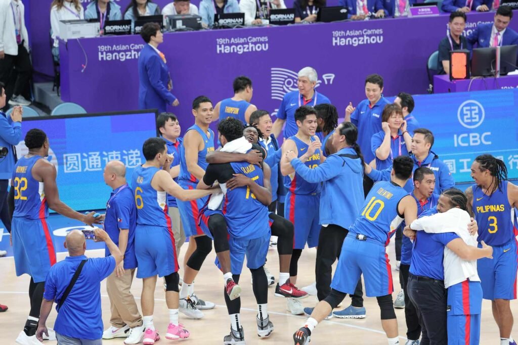 Gilas Pilipinas players celebrate after bagging the gold medal in men's 5x5 basketball at the 2023 Asian Games, bringing down Jordan, 70-60, on Friday night, October 6, in Hangzhou, China. [photo credi: PSC-POC Media Pool]