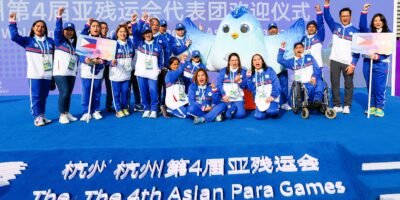 Team Philippines, led by chef de mission Ral Rosario, (second from right) raise their fists to signal that it is ready to fight in the 4th Hangzhou Asian Para Games during the welcome ceremony at the Athletes’ Games Village Friday, October 20. [PSC media photo]