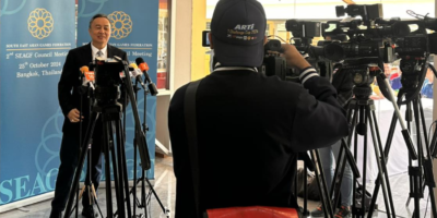 PHILIPPINE Olympic Committee president Abraham “Bambol” Tolentino answers questions from the Thai media in Bangkok [POC photo release]