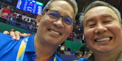 PHILIPPINE Olympic Committee President Rep. Abraham “Bambol” Tolentino and First Vice Al Panlilio, also head of the basketball association, do a selfie with the electronic scoreboard showing the final score of the Philippines-China game at the Smart Araneta Coliseum