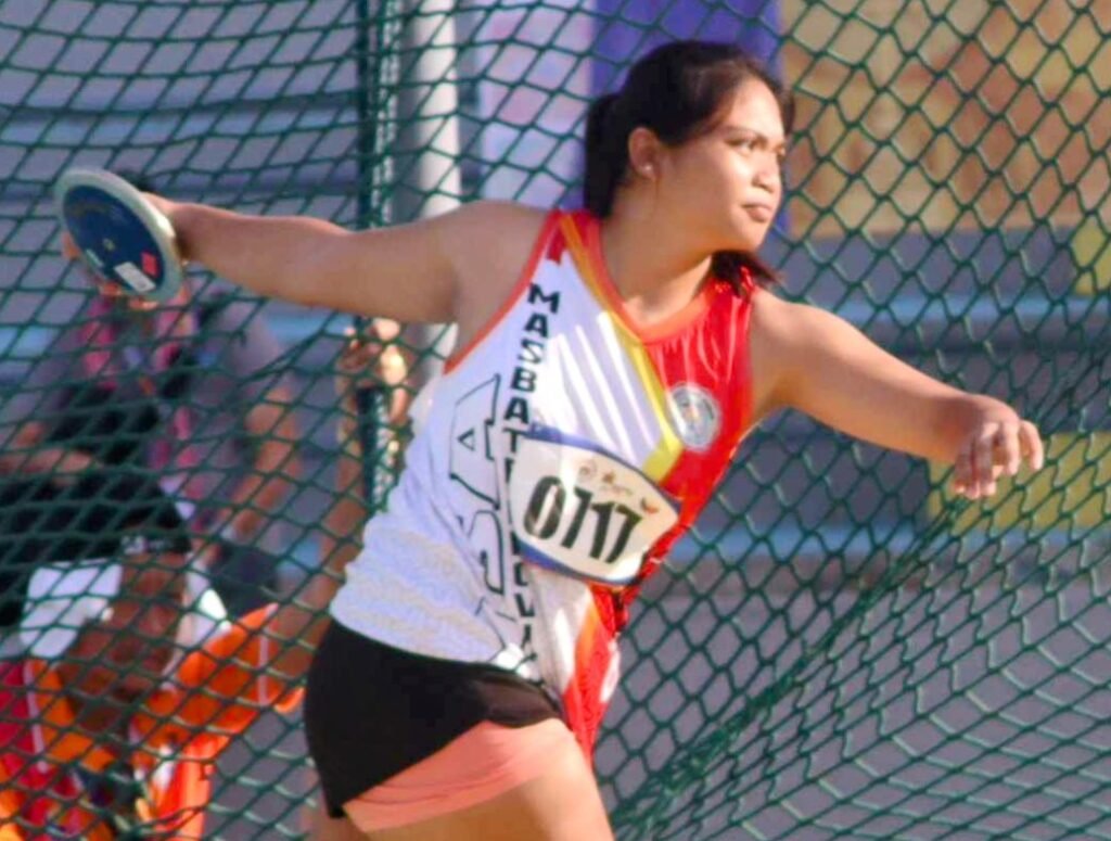 Masbate discus thrower Courtney Jewel Trangia (left photo) shows winning form in capturing the first gold [PSC photo]