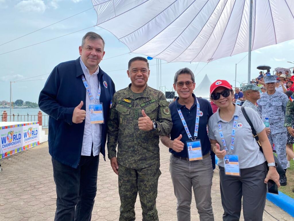 PSC Chairman Richard Bachmann (left most), AFP Chief-of-Staff Gen. Romeo Brawner, Jr. (second left), and PSC Comm. Walter Francis Torres (third left) during the opening rites of the 2024 ICF Dragon Boat World Championships in Puerto Princesa City, Palawan. [PSC photo]