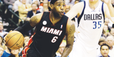 MIAMI Heat forward LeBron James (6) drives past Dallas Mavericks center Chris Kaman [AP photo]