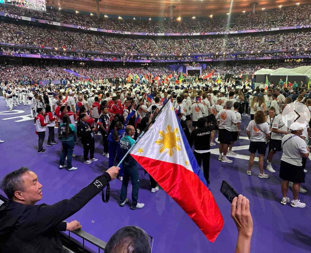 POC president Abraham “Bambol” Tolentino waves the country’s colors during the closing ceremony of the Paris 2024 Olympics last August. [POC photo]