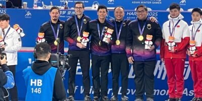 PH Men's Curling Team proudly claimed their hard-earned gold medal during the awarding rites of the Men's Curling event in the 9th Asian Winter Games in Harbin China. [Photo credit: Philippine Sports Commission]