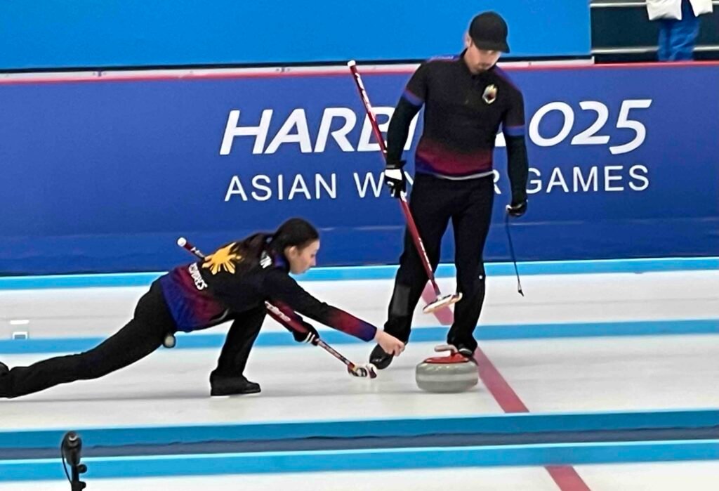 Marc Pfister and Kathleen Dubberstein of team Philippines are gearing up for the competition prior to their battle for bronze against No. 15 China.