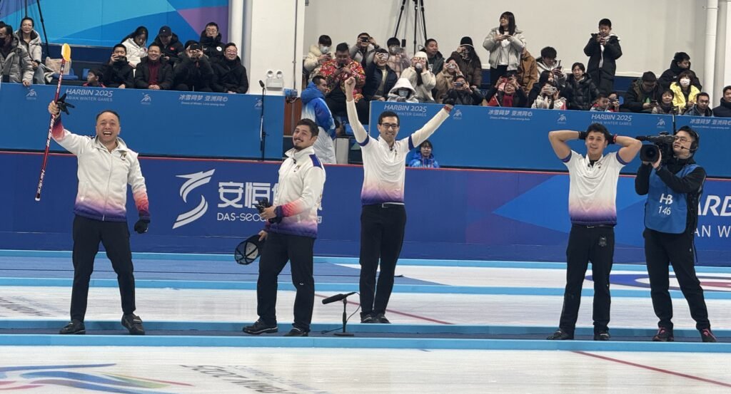 The Philippine men’s curling team celebrates after winning the country’s first-ever gold medal at the Asian Winter Games.