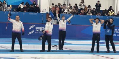 The Philippine men’s curling team celebrates after winning the country’s first-ever gold medal at the Asian Winter Games.