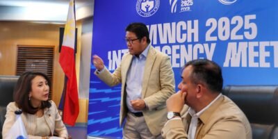 PNVF President Ramon “Tats” Suzara (standing) discusses with of Tourism Secretary Christina Frasco (left) and PSC chairman Richard Bachmann.