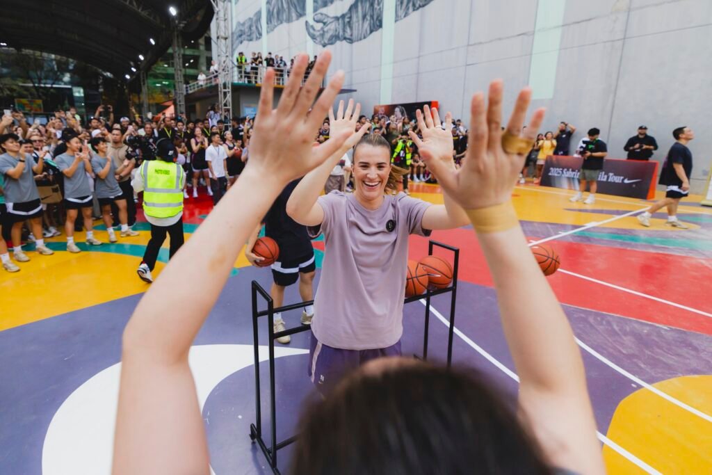 The WNBA star engages with young Filipino athletes at the Her Hoops skills camp.