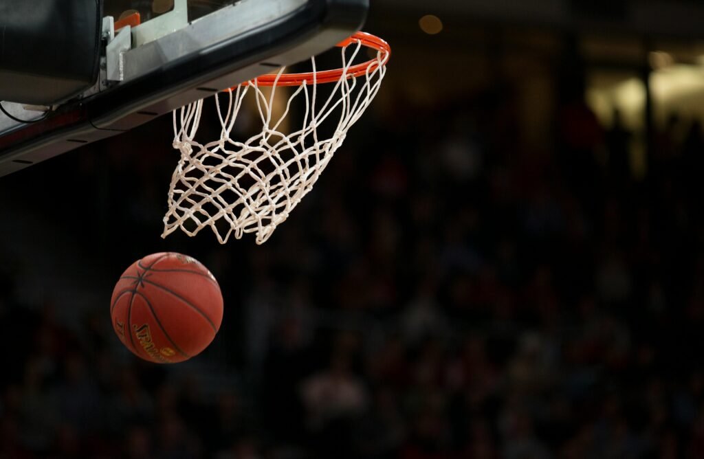Basketball representation image: [Photo by Markus Spiske from Pexels: https://www.pexels.com/photo/basketball-hoop-in-basketball-court-1752757/]