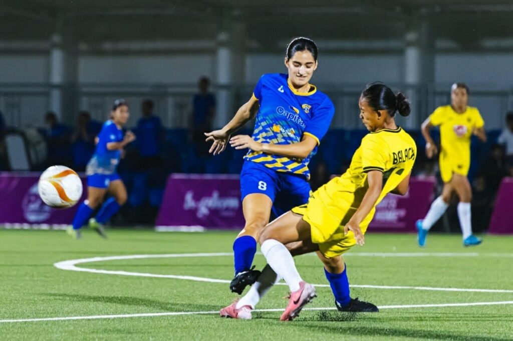 Capital1's Arianna del Moral tries to get past Kaya FC-Iloilo's Erma Balacua.