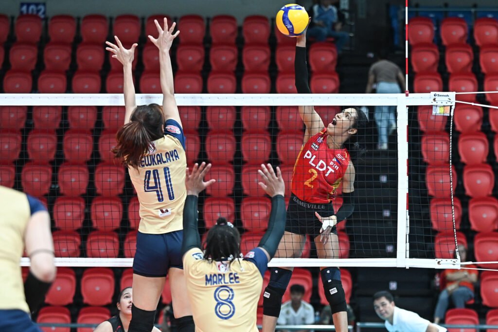 PLDT’s Wilma Salas attacks against the wall of Nakhon Ratchasima defenders. [PVL Images]