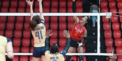 PLDT’s Wilma Salas attacks against the wall of Nakhon Ratchasima defenders. [PVL Images]