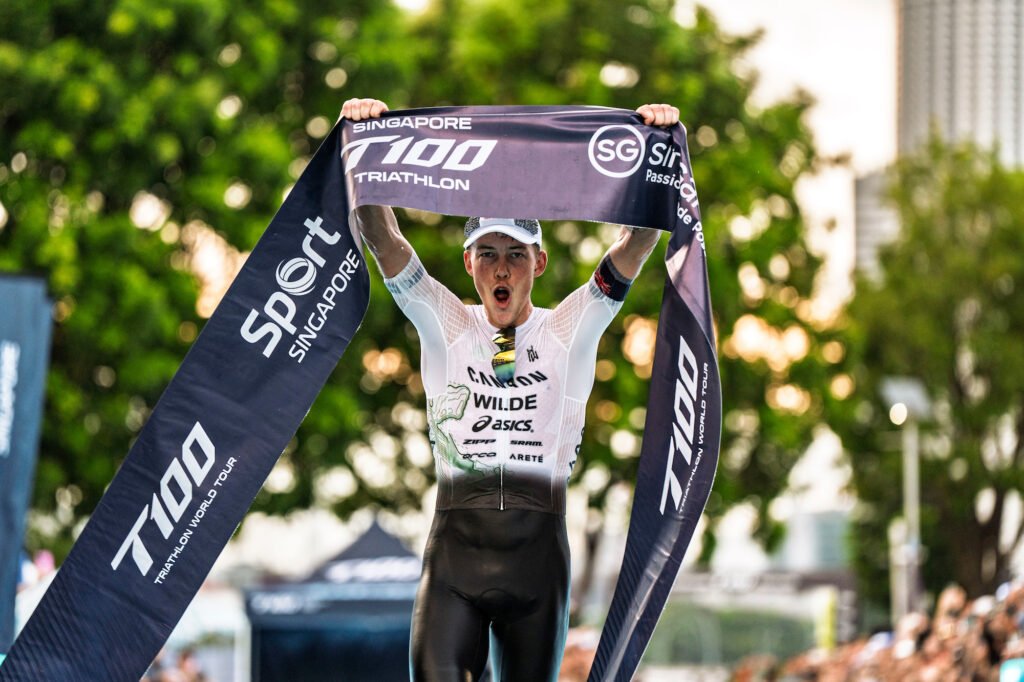 Hayden Wilde celebrates as he crosses the Singapore T100 finish line.