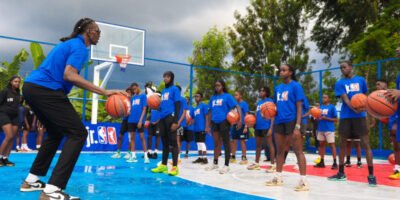 Children participate in a Jr. NBA clinic at the newly unveiled Loiswell Academy court