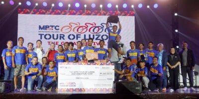 Asi Taulava celebrates with overall team champion MPT DriveHub, joined by MPTC Chief Regulatory Officer Arrey Perez, DuckWorld PH chairman Patrick “Pató” Gregorio, cycling legends Paquito Rivas, Carlo Guieb, Renato Dolosa, and Cignal TV executive Sienna Olaso during the closing ceremony held on May 1 at Camp John Hay.