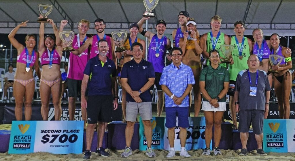 PHILIPPINE National Volleyball Federation (PNVF) president Ramon “Tats” Suzara (center, front row) and (from left, standing) FIVB Beach Volleyball Technical Delegate Baz Wedmeir, PNVF secretary-general Don Caringal, sports programs and events management consultant Dzi Gervacio and PNVF board member Tonyboy Liao with the winners of the tournament.