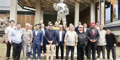 POC president Abraham “Bambol” Tolentino and ACC president Dato’ Amarjit Singh Gill along with POC executive board members and NSA heads and officials pose in front of the stainless steel 12-foot statue of National Hero Dr. Jose P. Rizal clad in fencing gear in front of the brand new Tagaytay City Hall.