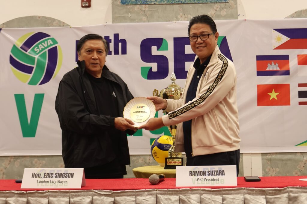 CANDON City Mayor Eric Singson (left) received a volleyball signed by the team captains of the SEA V.League teams from AVC and PNVF president Ramon “Tats” Suzara.