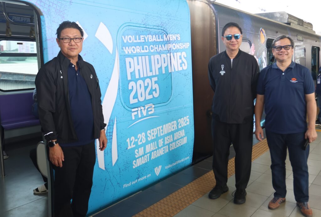 LRTA Administrator Atty. Hernando Cabrera (right) presents the specially-designed LRT-2 train to PNVF and AVC president Ramon “Tats” Suzara (left) and Philippine Sports Commission chairman Patrick Gregorio.