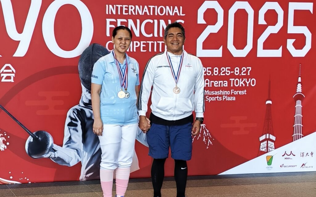 Ezkrima Philippines’ medalists Beverly and Rodolfo Alarcon proudly display their medals in Tokyo. [photo credit: Ezkrima Philippines]