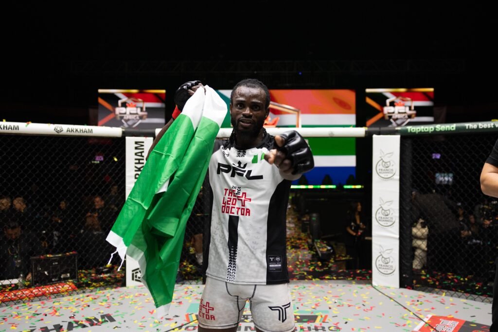 Patrick Ocheme celebrates his Featherweight semifinal berth after defeating Mohamed Camara in Johannesburg.