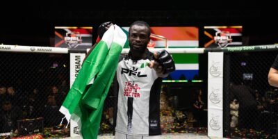 Patrick Ocheme celebrates his Featherweight semifinal berth after defeating Mohamed Camara in Johannesburg.