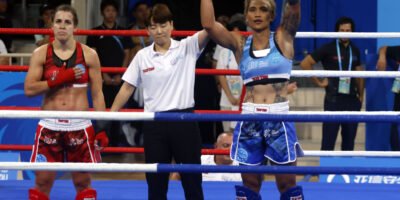 Hergie Bacyadan celebrates her quarterfinal win at the World Games kickboxing tournament in Chengdu.
