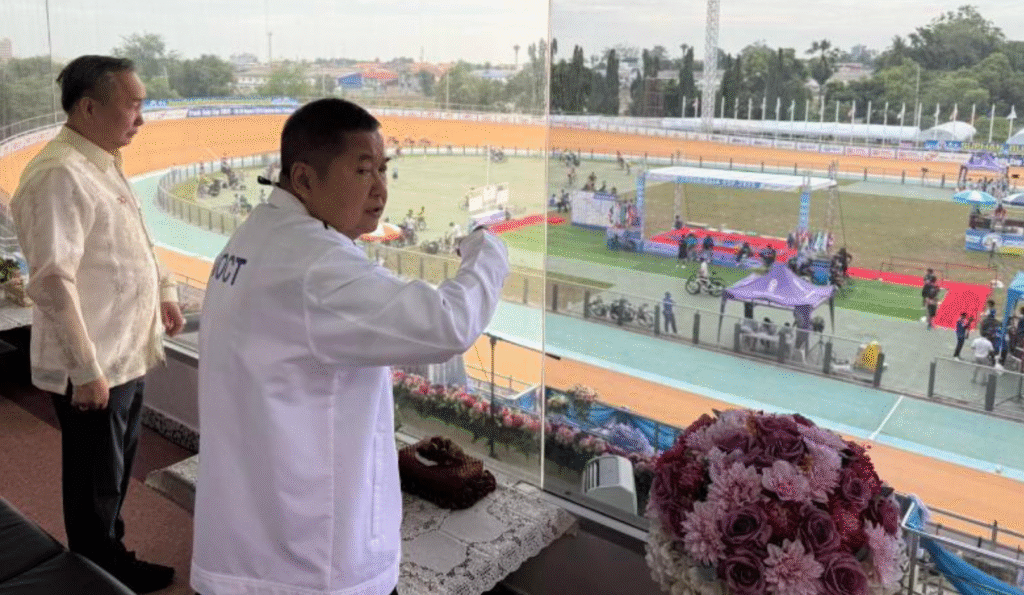 PHILIPPINE Olympic Committee (POC) president Abraham “Bambol” Tolentino observes the competitions with Thailand Cycling Association president General Decha Hemkasri at the Suphan Buri Velodrome. [POC photo]