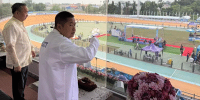 PHILIPPINE Olympic Committee (POC) president Abraham “Bambol” Tolentino observes the competitions with Thailand Cycling Association president General Decha Hemkasri at the Suphan Buri Velodrome. [POC photo]