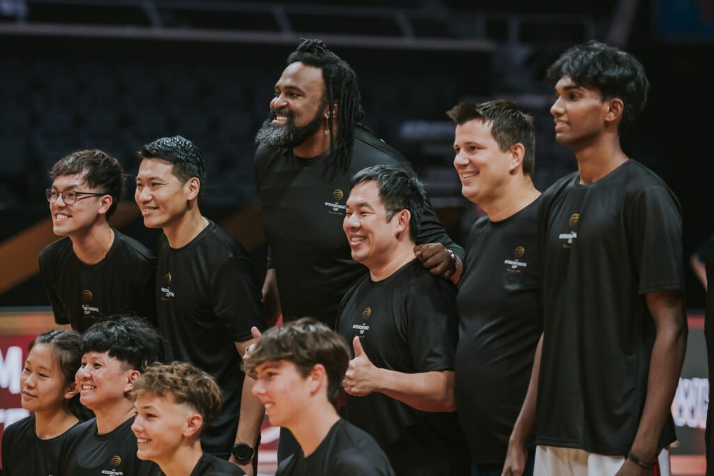 Community leaders and athletes pose together after the first-ever FIBA Intercontinental Cup pro-am match in Singapore. [photo credit: Singapore Sports Hub]