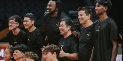 Community leaders and athletes pose together after the first-ever FIBA Intercontinental Cup pro-am match in Singapore. [photo credit: Singapore Sports Hub]