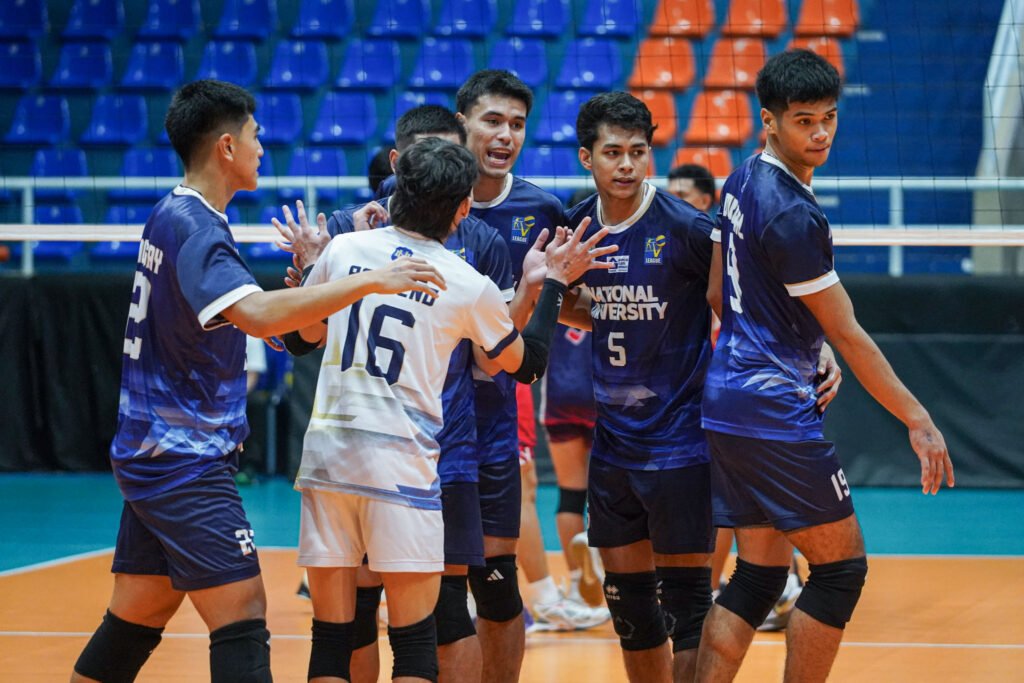 NU players regroup after dropping the opening set to Letran. [PVL Images]