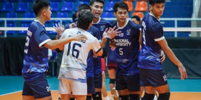 NU players regroup after dropping the opening set to Letran. [PVL Images]