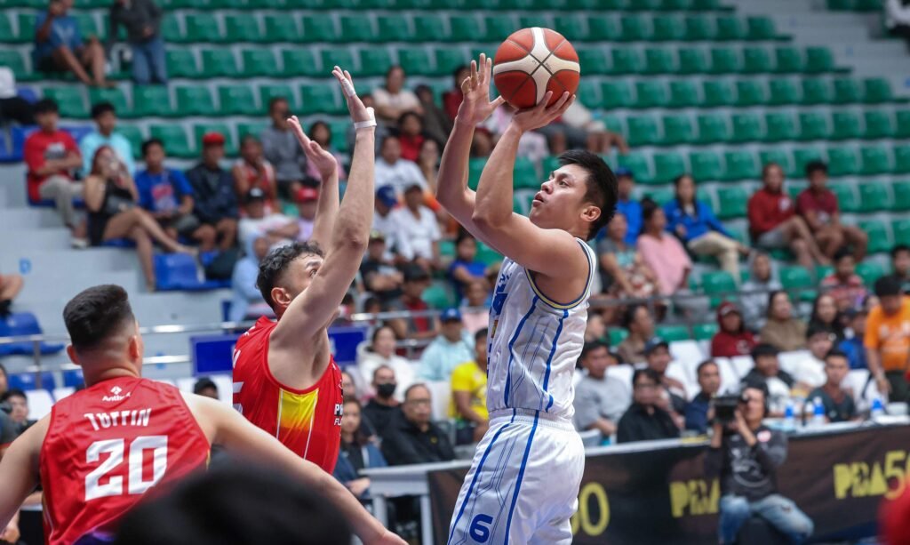 Rey Nambatac attacks the basket on his return as TNT beats Phoenix in the PBA Philippine Cup. [PBA Images]