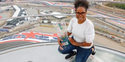 Girlstart receives the F1 Allwyn Global Community Award trophy during the US Grand Prix weekend in Austin.