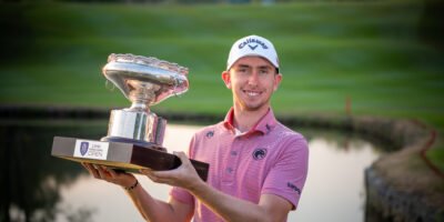 Tom McKibbin lifts the Hong Kong Open trophy after a wire-to-wire victory. [Asian Tour photo]