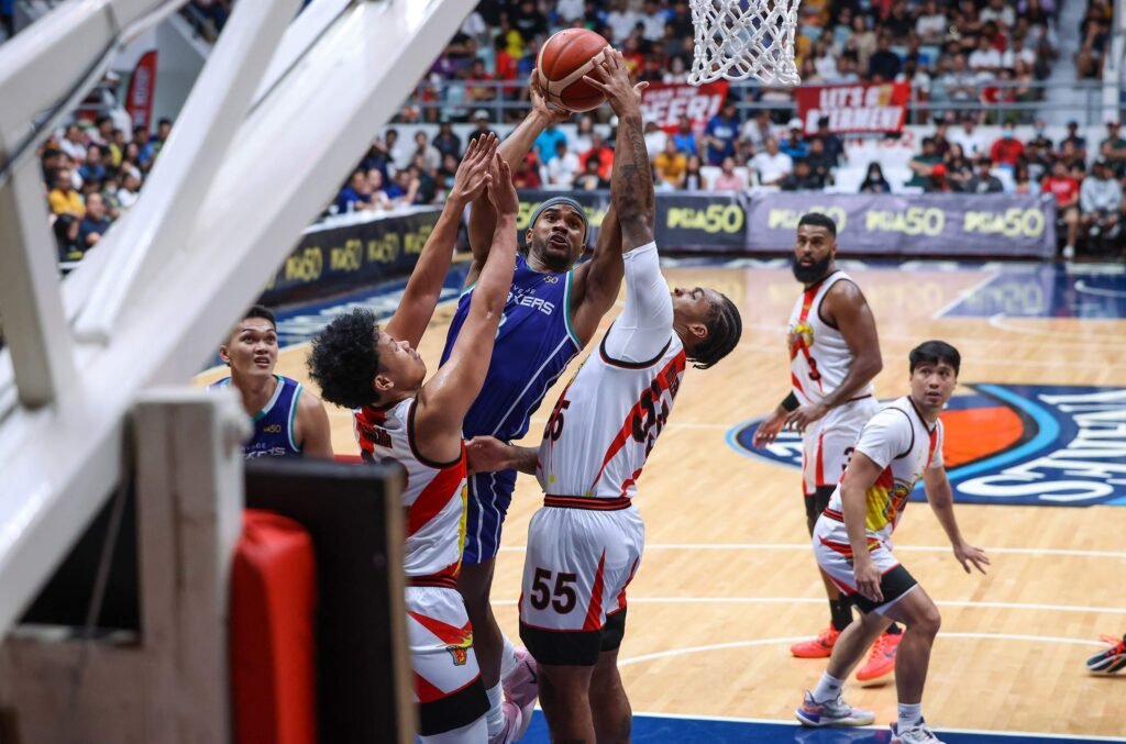 The Beermen lock in defensively against Converge’s early scoring burst. [PBA Images]