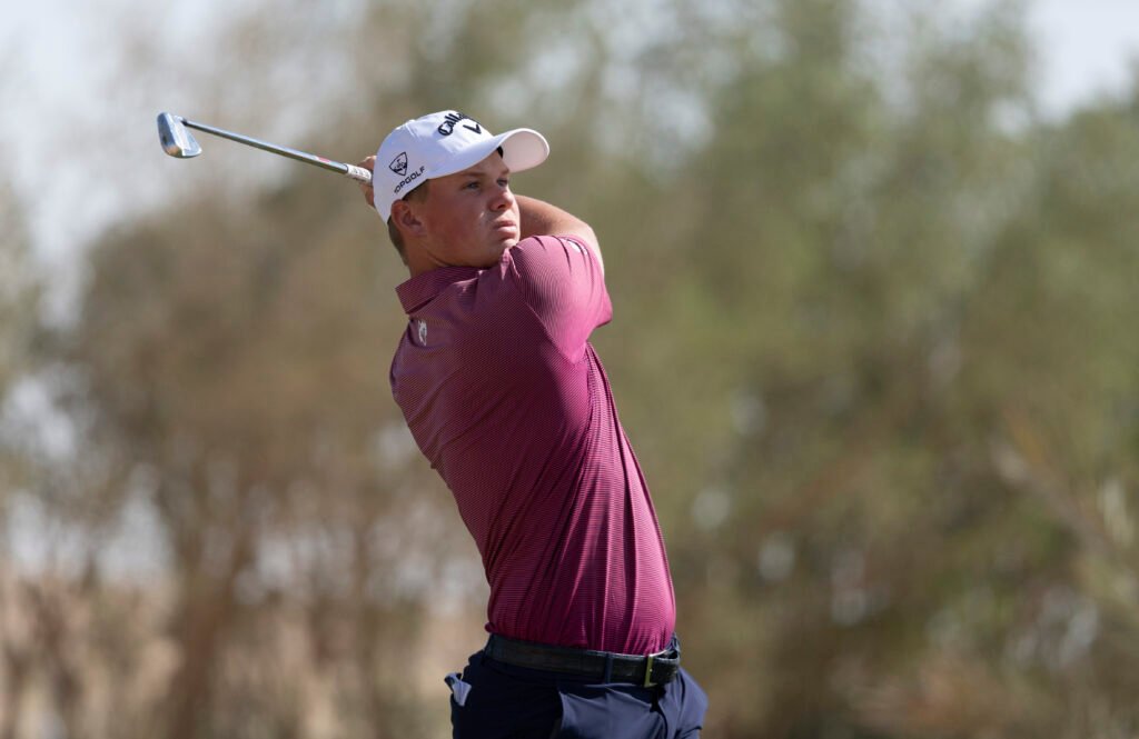 Caleb Surratt tees off during the third round at Riyadh Golf Club. [Asian Tour photo]