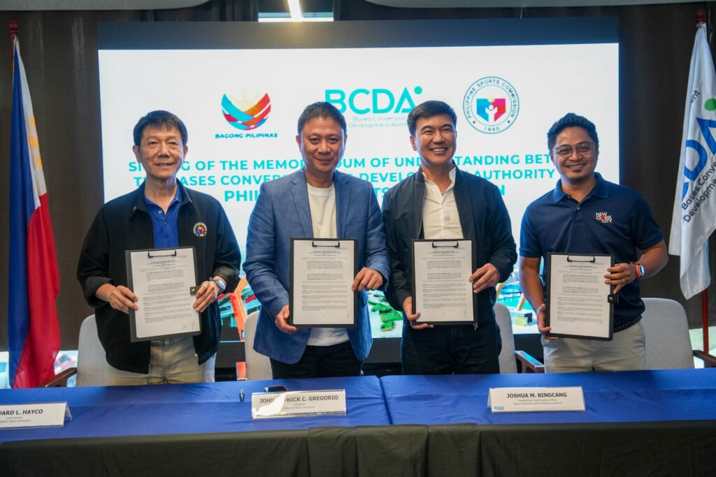 PSC Chairman Patrick Gregorio and BCDA President Joshua Bingcang sign the partnership agreement at New Clark City. [PSC photo]