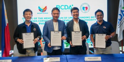 PSC Chairman Patrick Gregorio and BCDA President Joshua Bingcang sign the partnership agreement at New Clark City. [PSC photo]