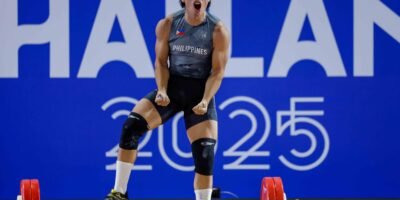 Delos Santos celebrates after setting a new world juniors record in the clean and jerk. [POC Media Pool]