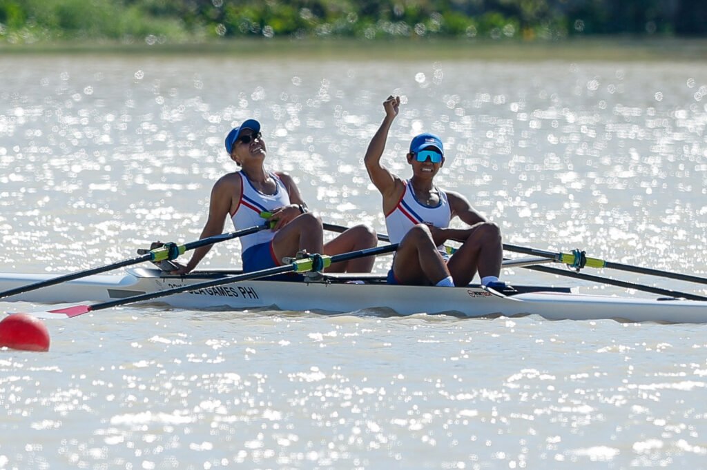 Joanie Delgaco and Kristine Paraon celebrate after winning gold in the women’s 2,000-meter rowing event at the SEA Games in Rayong. [POC Media Pool]